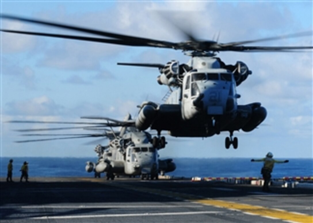 A U.S. Marine Corps CH-53E Sea Stallion helicopter assigned to Marine Medium Helicopter Squadron 262 takes off from the flight deck of the forward-deployed amphibious assault ship USS Essex (LHD 2) on Nov. 22, 2010.  The Essex is part of the permanently forward-deployed Essex Amphibious Ready Group underway in the western Pacific Ocean.  