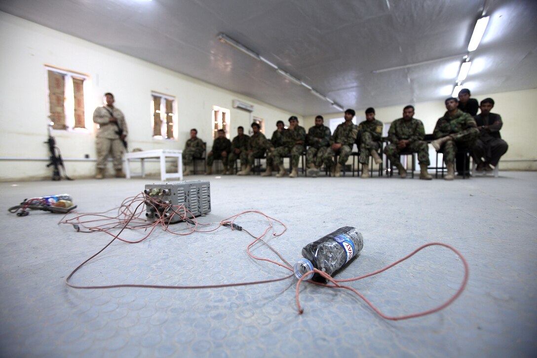Afghan National Army soldiers receive improvised explosive device training at Camp Dwyer, Helmand province, Afghanistan, Nov. 24. The Regimental Combat Team 1 Embedded Training Team instructed them in identifying IEDs, mitigating IED threats during patrols and identifying various kinds of unexploded ordnance.