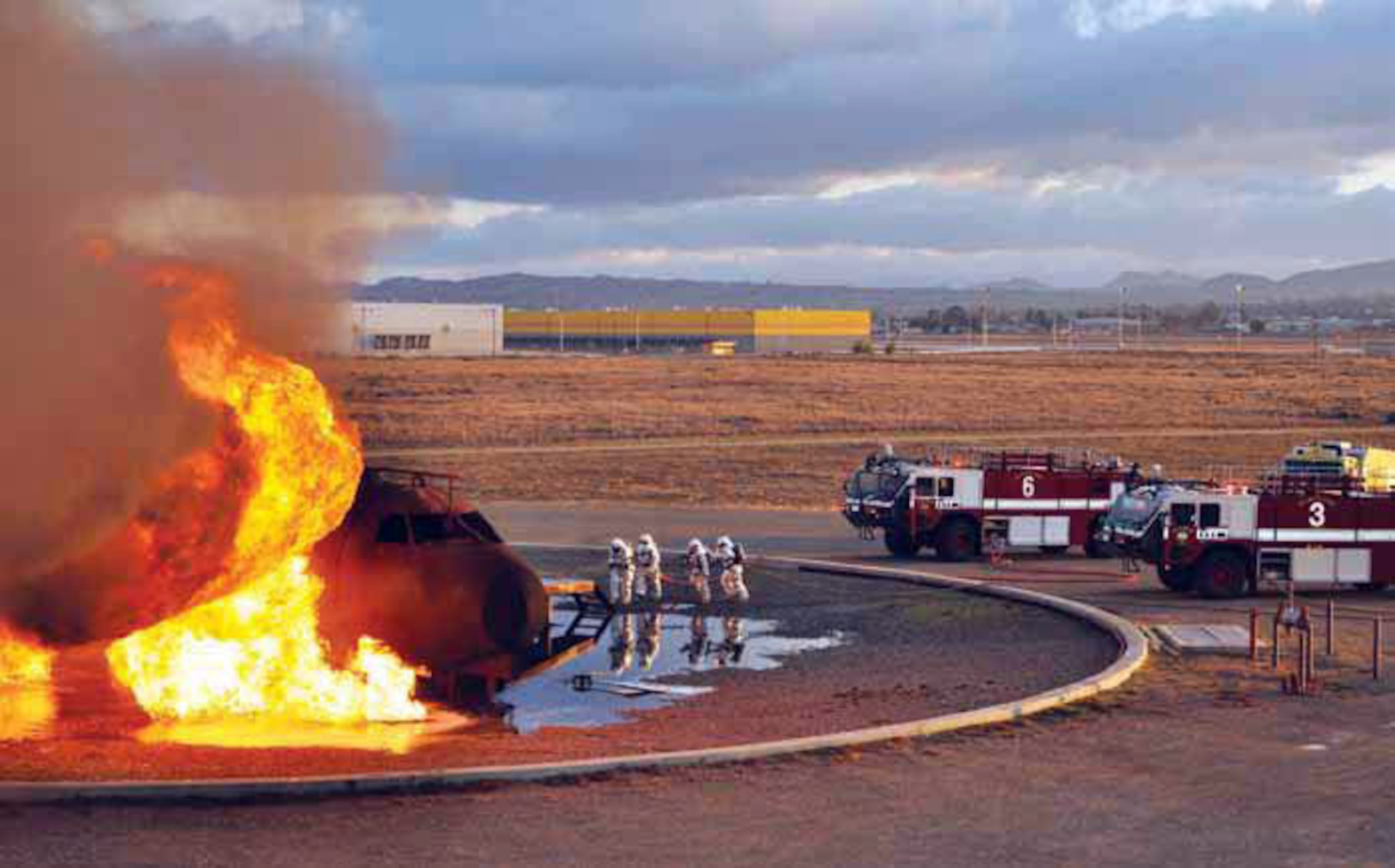 VH1 crews film March Air Reserve Base firefighters putting out flames on their trainer aircraft. (U.S. Air Force photos by Linda Welz)