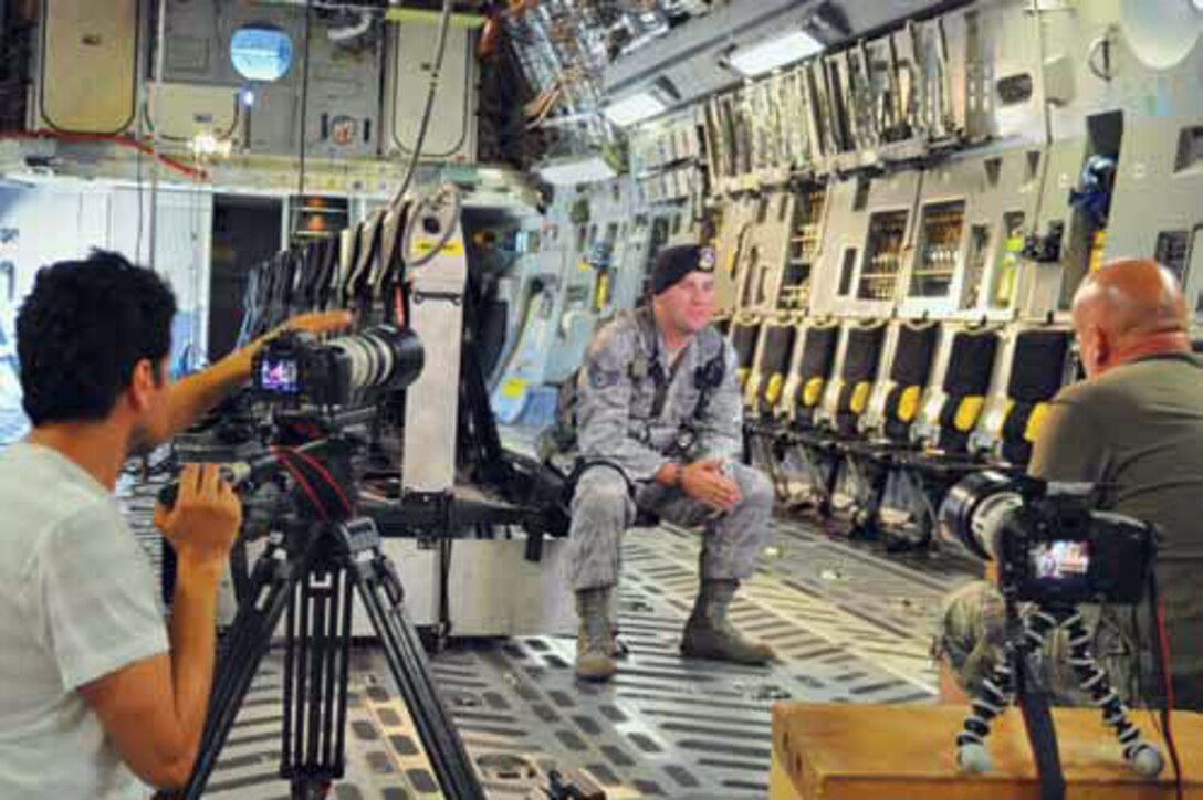 Staff Sgt. Paplo Castillo, 452nd Security Forces Squadron is interviewed on board a C-17 Globemaster. (U.S. Air Force photos by Linda Welz)