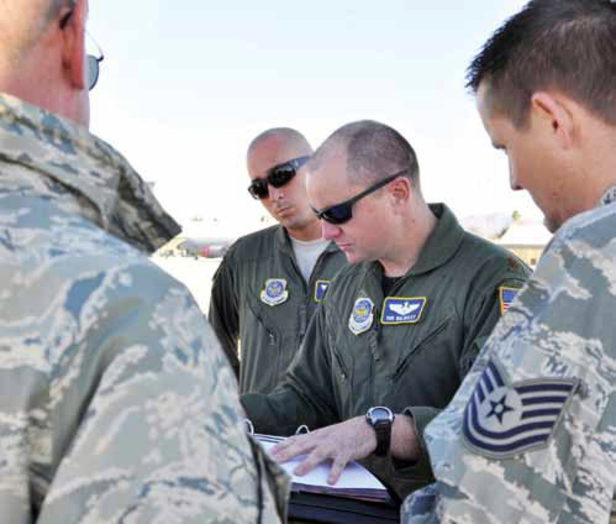 Maj. Rob Walmsley conducts pre-flight checks with members of the Nov. 9 crew. (U.S. Air Force photo by Linda Welz)