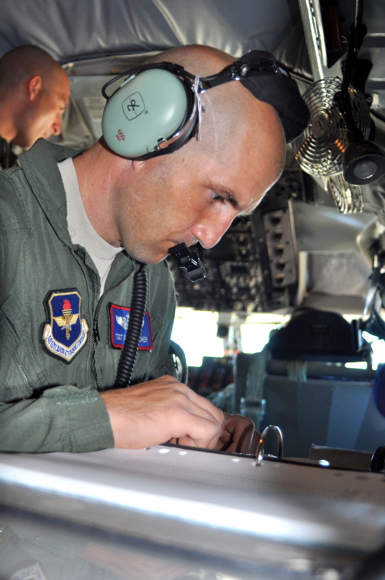 Boom operator Tech. Sgt. Dan Beecher reviews a pre-flight checklist.  (U.S. Air Force photo/ Linda Welz) 