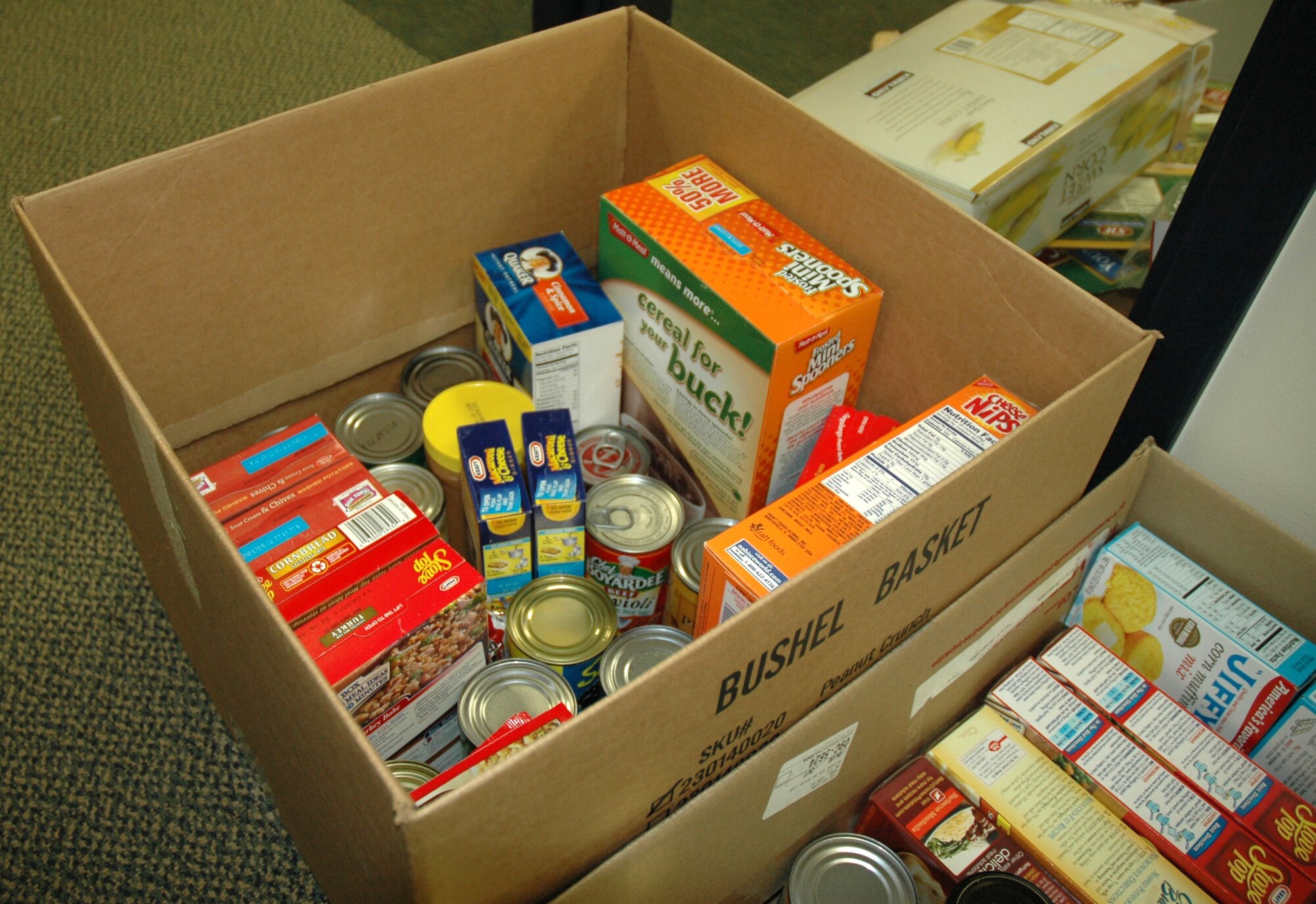 JOINT BASE LEWIS-MCCHORD, Wash.- A Thanksgiving basket donated from the USO waits in the 446th Mission Support Group Airmen and Family Readiness Center to be distributed to a needy family in the 446th Airlift Wing, Nov. 23. Care and Share is designed to help wing families in need during the holiday season. Reservists with Airmen and Family Readiness, 446th Logistics Readiness Flight and the 446th Aircraft Maintenance Squadron Top 3 helped put together about 30 baskets of food to distribute to families. About 20 gift cards will be sent out to families who live more than 50 miles away from base and didn't receive a basket. (U.S. Air Force photo/Master Sgt. Jake Chappelle)