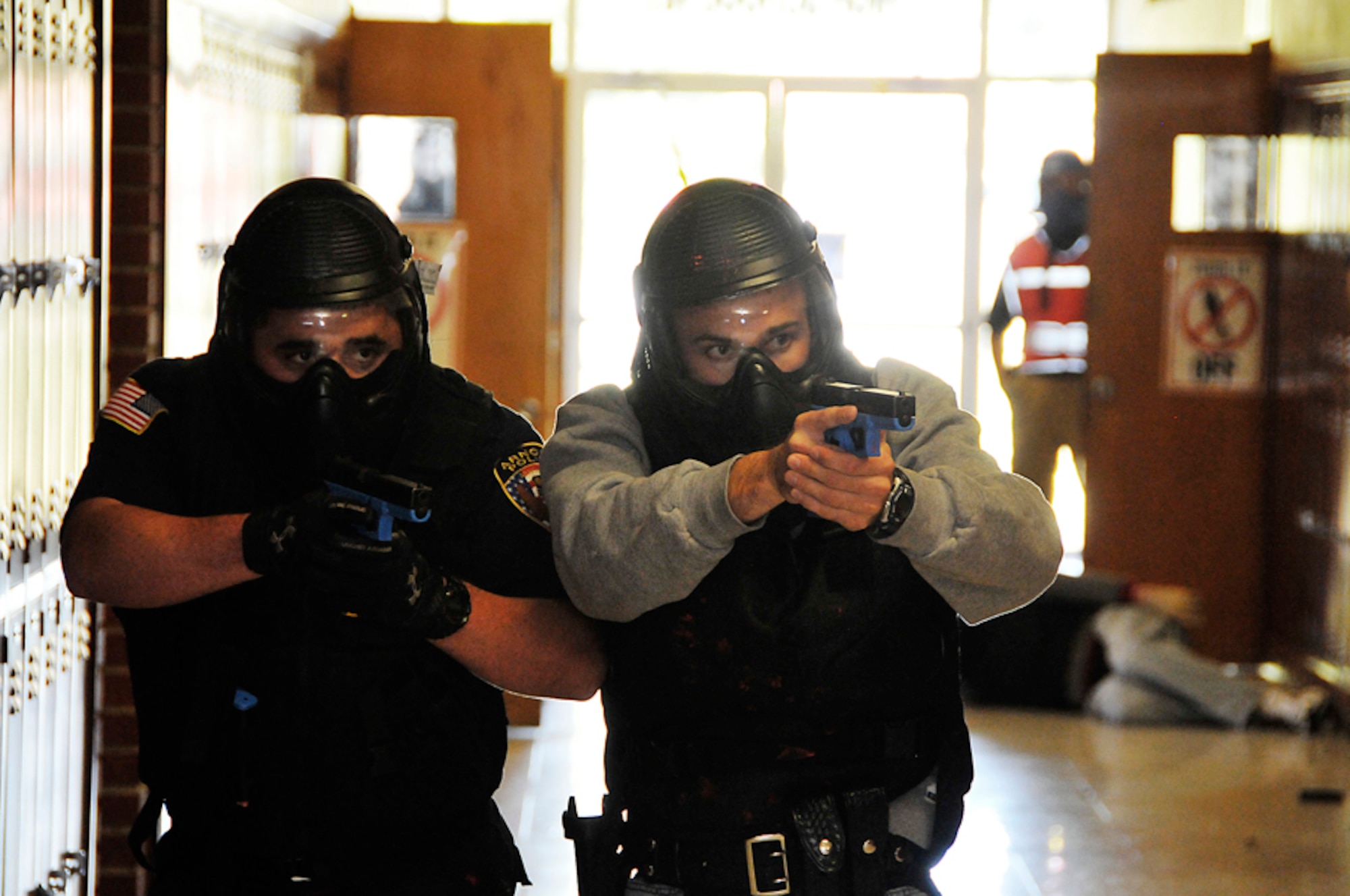 Arnold Police Officer Jason Lane and Tullahoma Officer Tyler Hatfield advance on a subject who has fired on them and is hidden in a room at Tullahoma High School during active shooter training Oct 14. (Photo by: Rick Goodfriend)