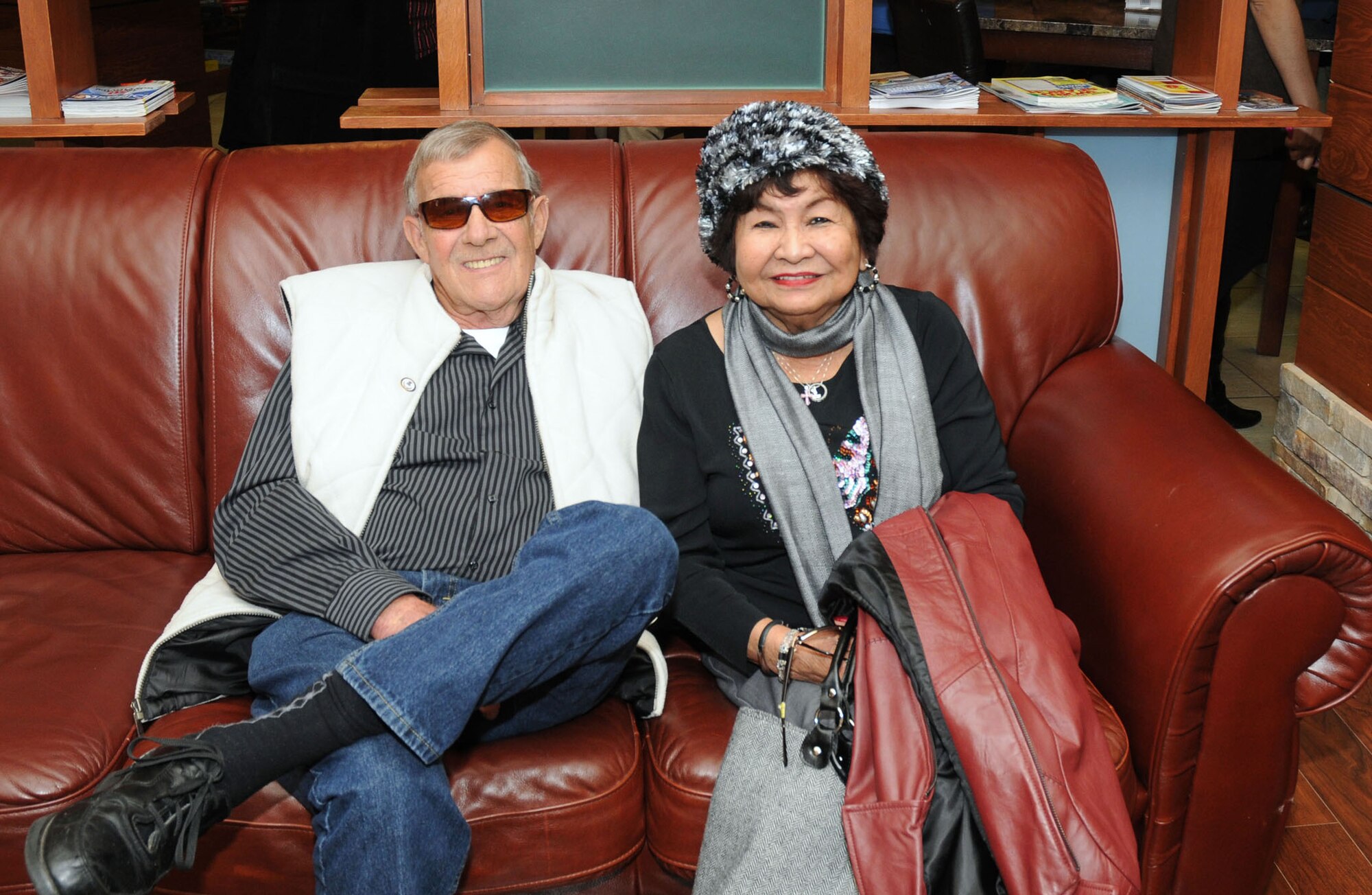 Ron and Gloria Leet, USO Delaware volunteers, share a moment on the couch inside the USO Community Center, Dover Air Force Base, Del., Nov 23, 2010. On their 55th wedding anniversary, the couple attended a USO meeting before celebrating their milestone achievement. (U.S. Air Force photo by Senior Airman Jessica Cendana
/Released)
