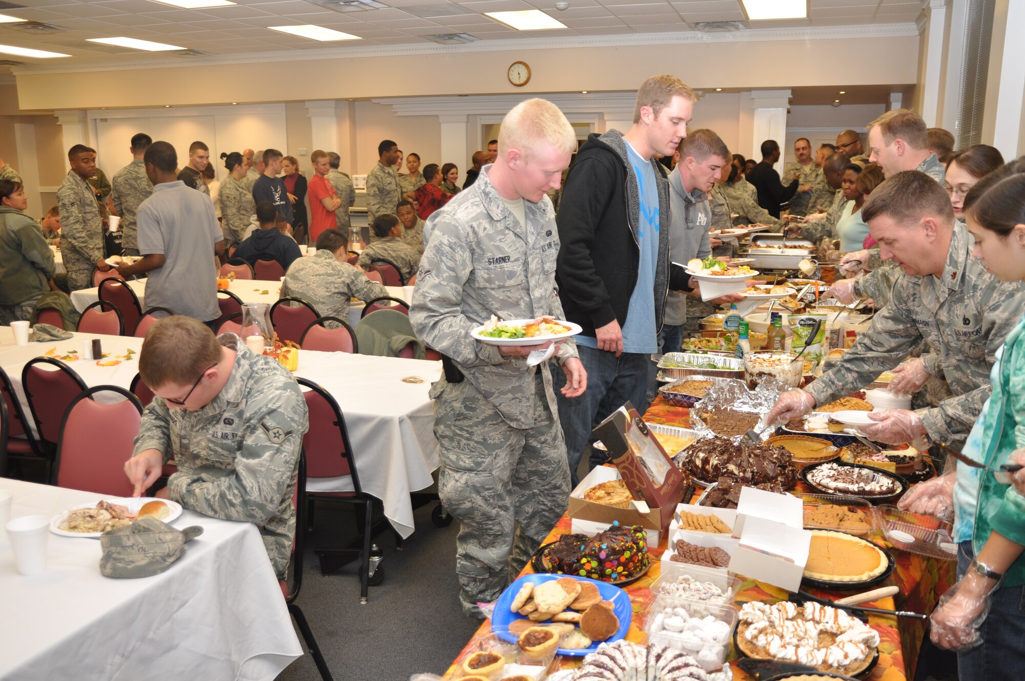 The base chapel was packed with attendees and volunteers for the Nov. 18 Dormsgiving event. Leaders from all over the base came and offered their services to help make a Thanksgiving dinner for enlisted dorm residents. (U.S. Air Force photo/Airman 1st Class Chase Hedrick