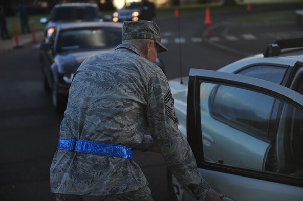 Chief Master Sergeant Craig Recker, 15th Wing command chief, greets a student of Hickam Elementary as they exit their car Nov. 24 at Joint Base Pearl Harbor Hickam. 15th Wing leadership visited the school to wish students and parents a happy and safe Thanksgiving. (U.S. Air Force photo/Staff Sgt. Nathan Allen) 


