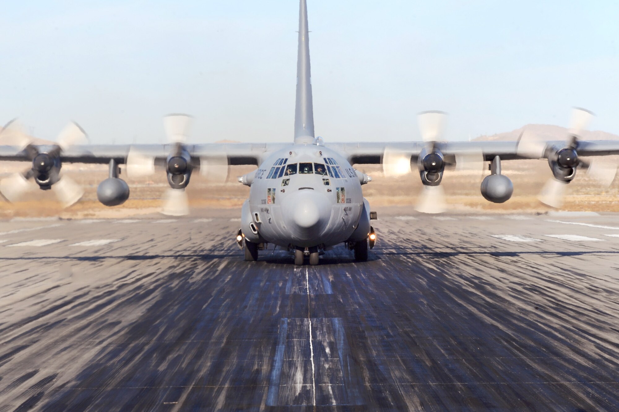 A C-130 Hercules taxis down the runway after a Mobility Air Forces Exercise Nov. 17, 2010, at Nellis Air Force Base, Nev. Approximately 40 C-17 Globemaster IIIs and C-130 Hercules assembled in aerial formations over the Nevada Test and Training Range to conduct air and ground operations as part of the bi-annual Air Force Weapons School exercise. (U.S. Air Force photo/Master Sgt. Kevin J. Gruenwald)