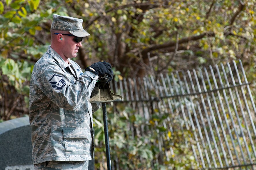 Master Sgt. Dave Hickok with 139th Airlift Wing, Missouri Air National Guard, helps clean up the Mount Mora historical cemetary on November 10, 2010. This is the third year that volunteers from the 139th have assisted with the efforts to clean up the cemetary where their founder, Col. John B. Logan is buried. (U.S. Air Force photo by Master Sgt. Shannon Bond/Released)