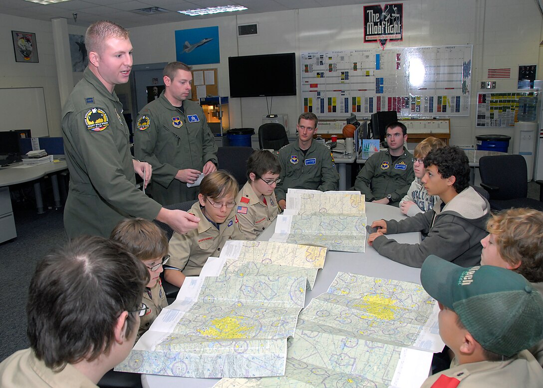 Student pilots from the 469th Flying Training Squadron teach Boy Scouts about flight navigation, Nov. 20, in the M Flight room at Sheppard Air Force Base, Texas. The scouts attended six different seminars to learn about aviation and earn their Aviation Merit Badge. The seminars were organized and taught by student volunteers from the 469th TRS class 11-03. (U.S. Air Force photo/Harry Tonemah) 