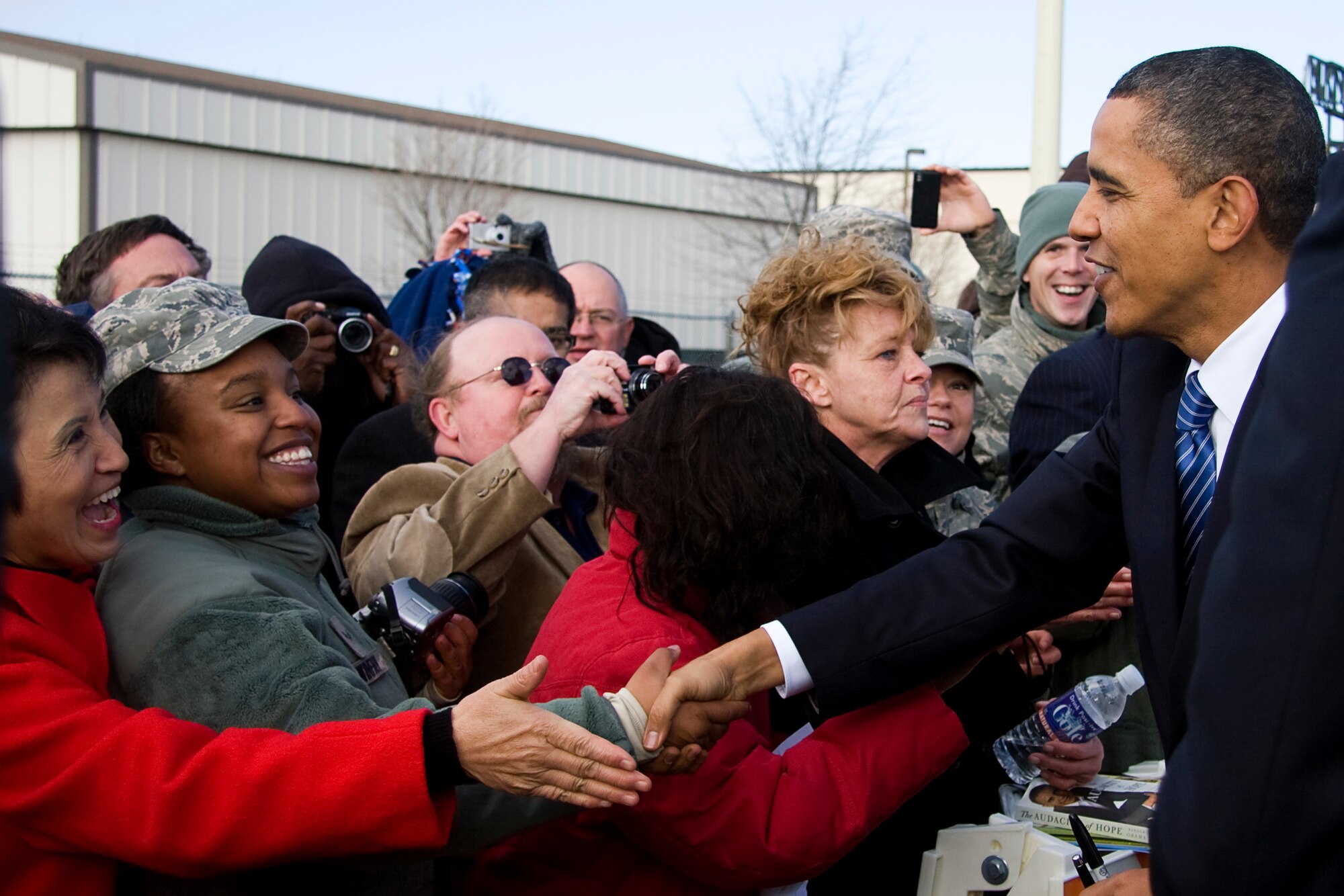 GRISSOM AIR RESERVE BASE, Ind. -- Airman 1st Class Daisy Winfrey is all smiles as she shakes the hand of President Barack Obama during his visit to Grissom Nov. 23. President Obama, along with Vice President Joe Biden, arrived at Grissom before heading to nearby Kokomo, Ind., on their White House to Main Street tour. Airman Winfrey is a knowledge operations apprentice with the 434th Mission Support Group. (U.S. Air Force photo/Tech. Sgt. Mark R. W. Orders-Woempner) 