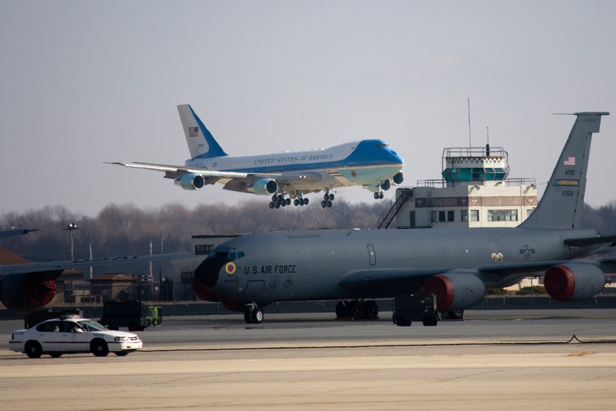 GRISSOM AIR RESERVE BASE, Ind. -- Air Force one can be seen flying into Grissom Air Reserve Base just above one of the 434th Air Refueling Wing's KC-135R Stratotankers Nov. 23. President Obama arrived at Grissom aboard Air Force One before departing for nearby Kokomo, Ind., during his White House to Main Street tour. (U.S. Air Force photo/Tech. Sgt. Mark R. W. Orders-Woempner) 
