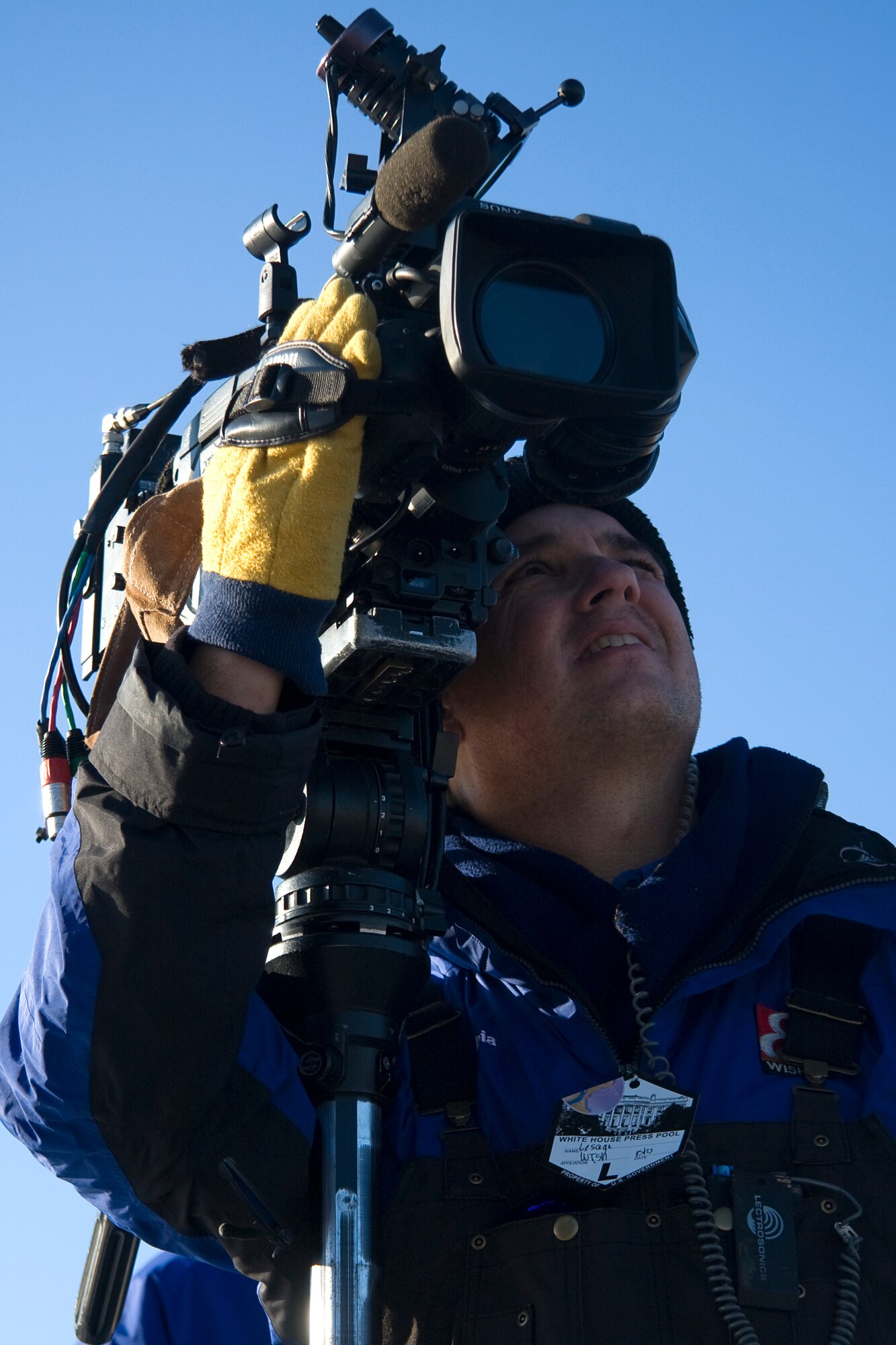 GRISSOM AIR RESERVE BASE, Ind. -- John Lesage, a photographer from an Indianapolis media outlet, aims to get a shot of Air Force One taking off from Grissom Nov. 23. Air Force One landed at Grissom carrying President Barack Obama during his White House to Main Street tour. President Obama, along with Vice President Joe Biden, visited several locations in nearby Kokomo, Ind., during the visit. (U.S. Air Force photo/Tech. Sgt. Mark R. W. Orders-Woempner) 