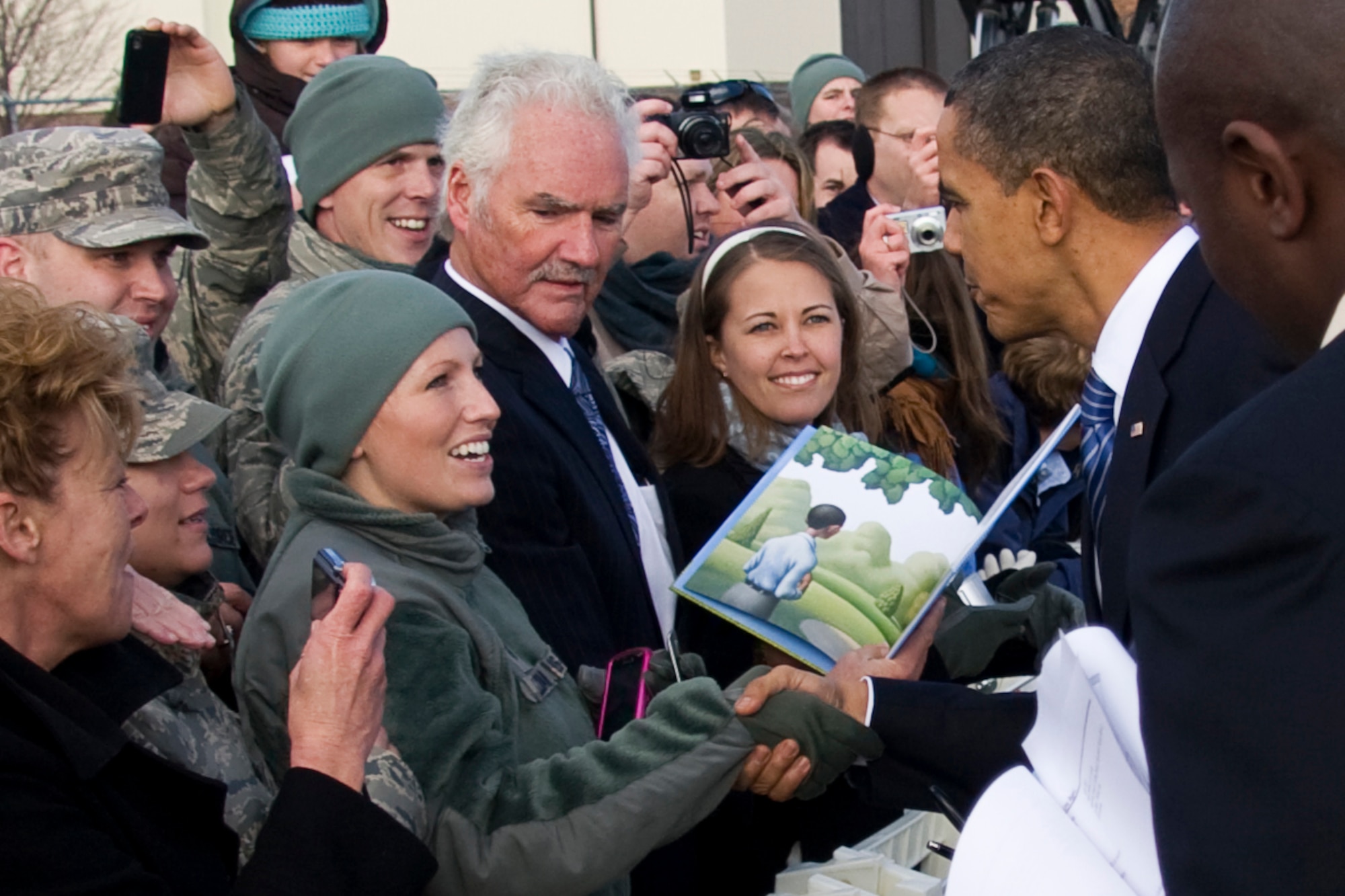 GRISSOM AIR RESERVE BASE, Ind. -- Tech. Sgt. Jonna Sullivan greets President Barack Obama with a handshake shortly after he arrived at Grissom Nov. 23. President Obama and Vice President Joe Biden were in the region to discuss the economy on their White House to Main Street tour. Sergeant Sullivan is a noncommissioned officer in charge of the 434th Operations Support Squadron orderly room. (U.S. Air Force photo/Tech. Sgt. Mark R. W. Orders-Woempner) 