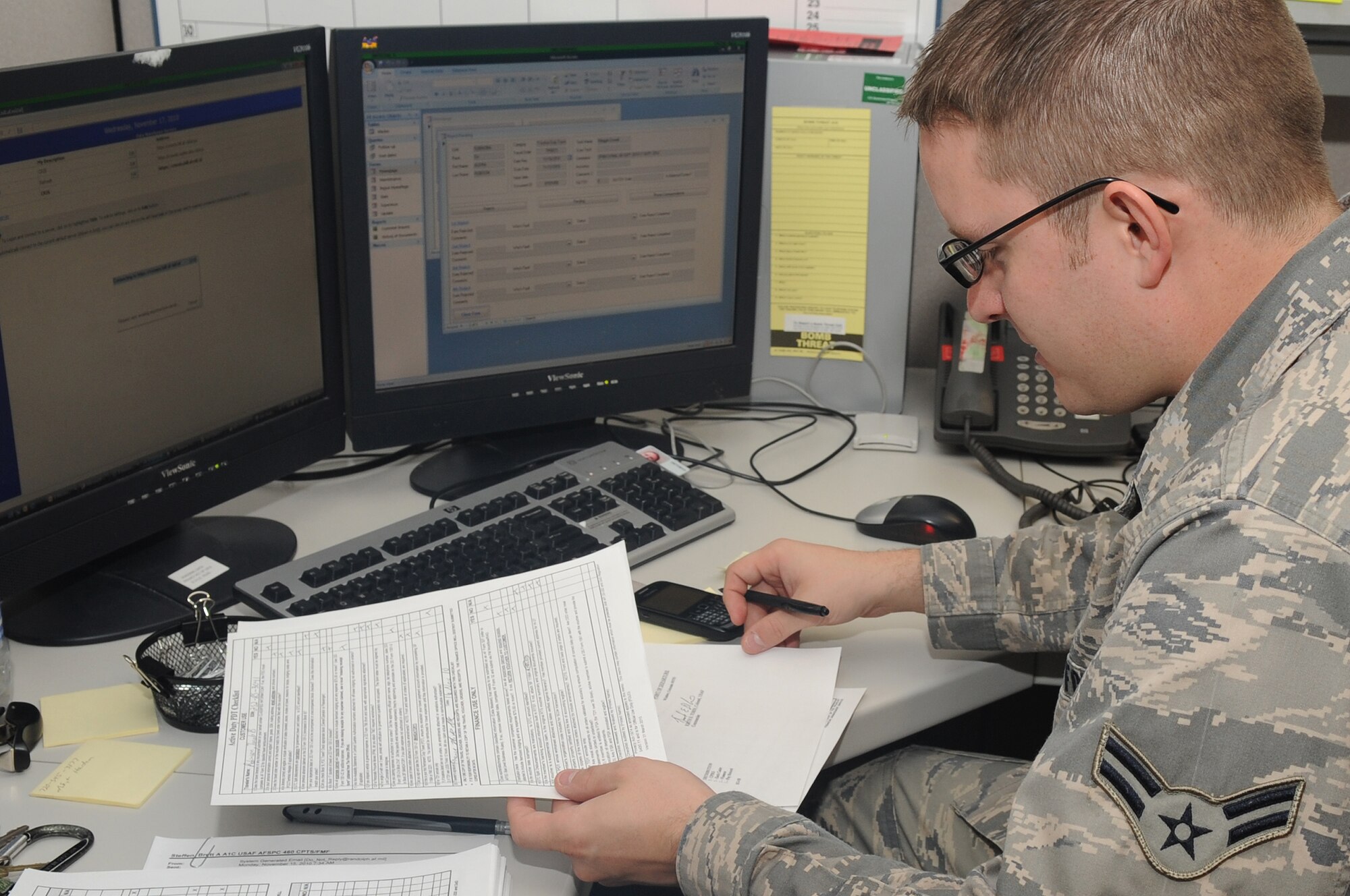 Airman 1st Class Brett Steffen inputs financial records into the database at the military personnel flight on Nov 17. After the information is put into several databases it is transmitted to the Air Force Financial Services Center at Ellsworth Air Force Base. (U.S. Air Force Photo by Airman Manisha Vasquez)