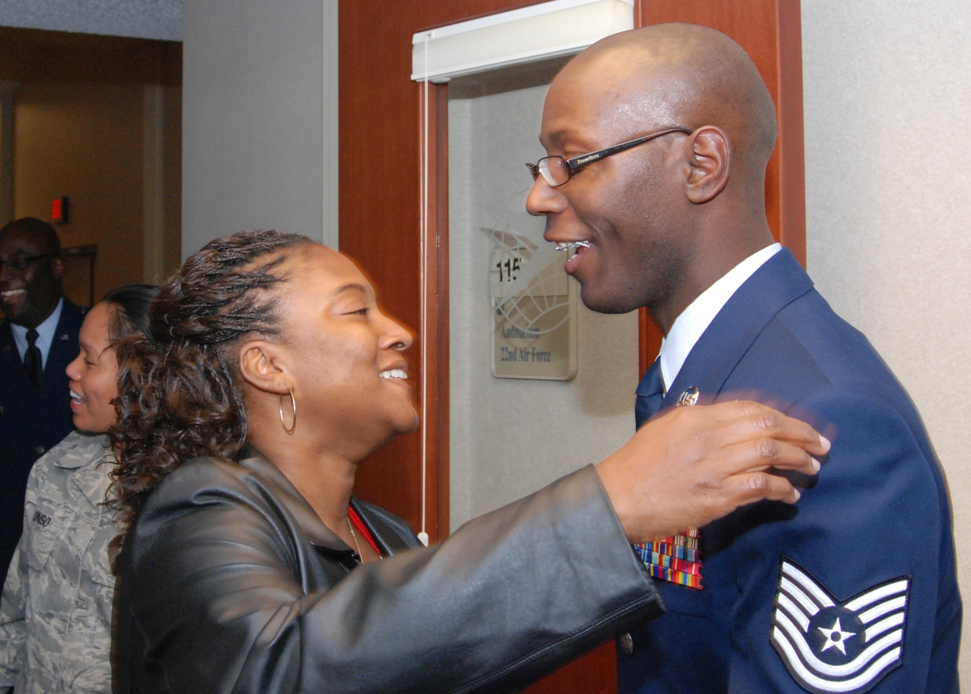 Tech. Sgt. Jermaine Knight, 94th Services unit deployment manager, received congratulations from Airmen, retired civilians and friends during the reception line greetings after his retirement ceremony Nov. 6.  (U.S. Air Force photo/Master Sgt. Stan Coleman)  