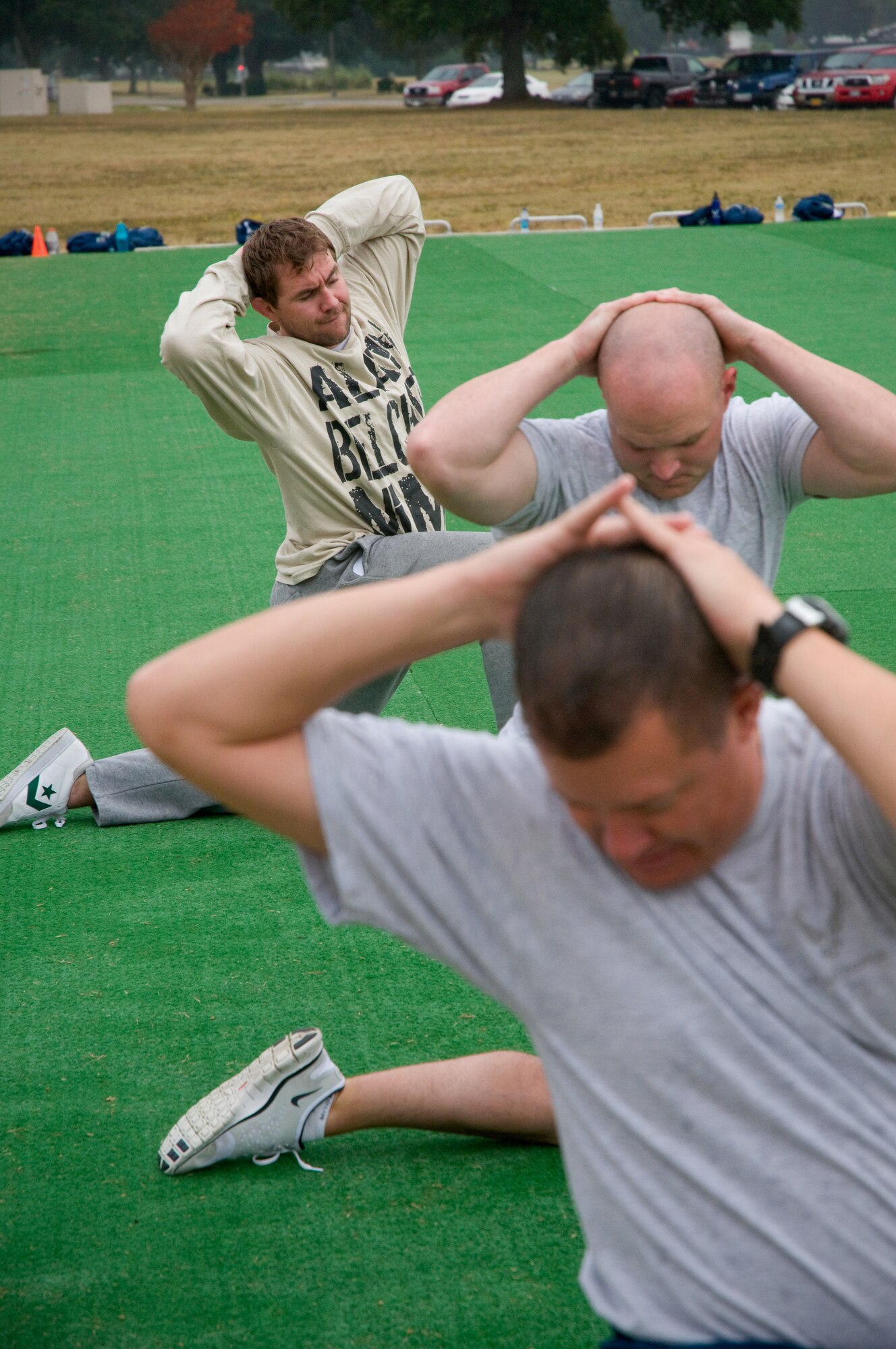 Adam Belcher, top, works out with Maj. James Clark, front, 81st Security Forces
Squadron commander, and Capt. Jason Williams during an exercise session with
Keesler cops Nov. 15 at the exercise pad by the Triangle Track. Mr. Belcher is a Ultimate Fighting Championship middleweight fighter with a record of 16-6. He
fights out of Remix Mixed Martial Arts in Biloxi. (U.S. Air Force photo by Adam Bond)