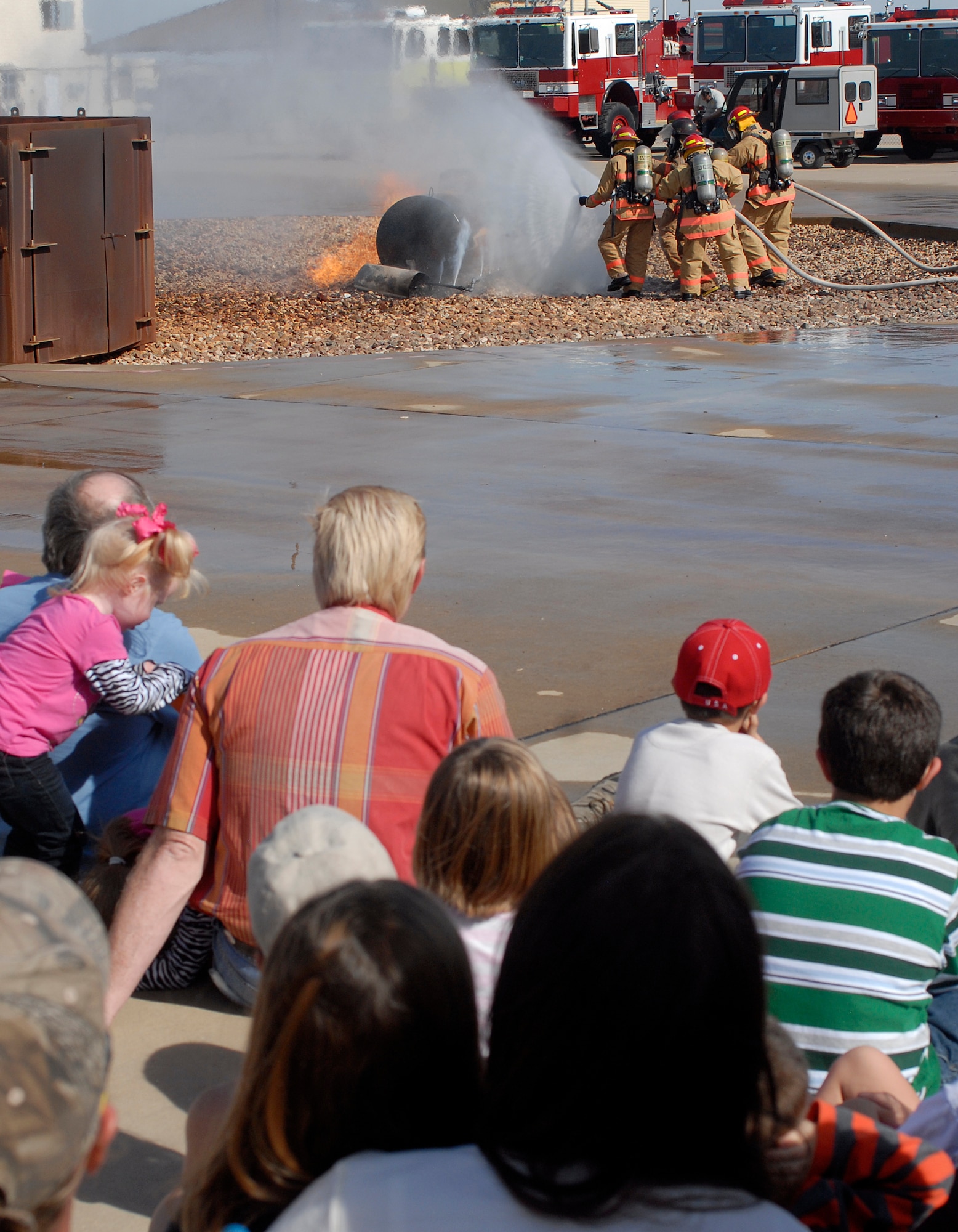 GOODFELLOW AFB, Texas – Instructors from the 312th Training Squadron demonstrates how they would extinguish a propane tank fire as part of the annual Goodfellow Community Appreciation Day Nov. 20.  Goodfellow opened its doors for the day to allow the local community the opportunity to get a glimpse of the vital mission that the base performs.  (U.S. Air Force photo/Master Sgt. Randy Mallard)