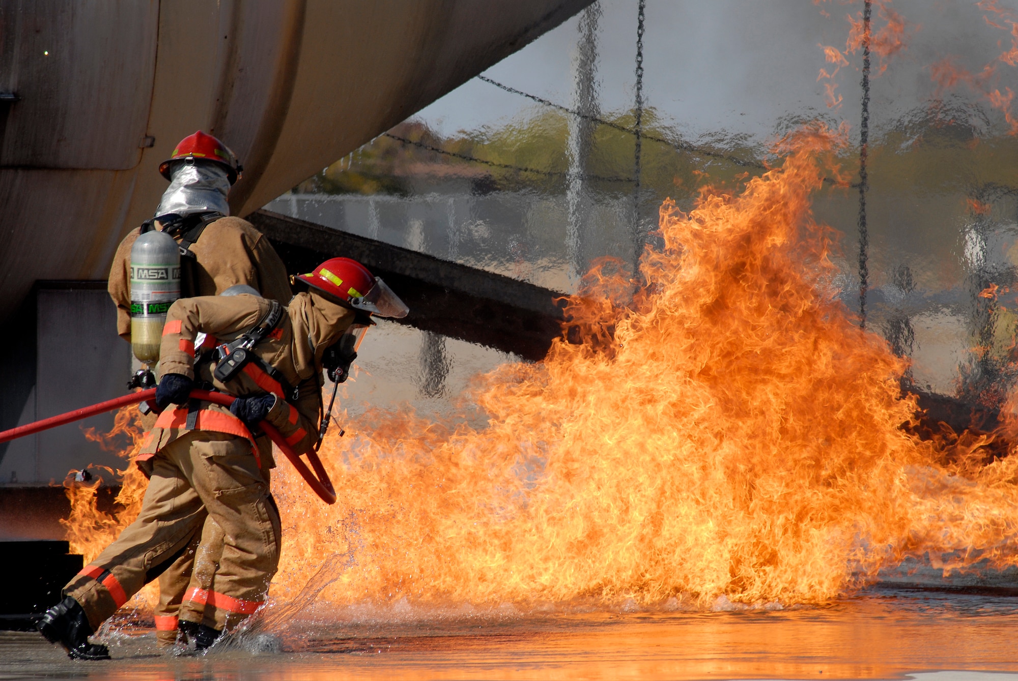 GOODFELLOW AIR FORCE BASE, Texas – Instructors from the 312th Training Squadron demonstrate how they would extinguish an aircraft fire as part of the annual Goodfellow Community Appreciation Day Nov. 20.  Goodfellow opened its doors for the day to allow the local community the opportunity to get a glimpse of the vital mission that the base performs.  (U.S. Air Force photo/Master Sgt. Randy Mallard)