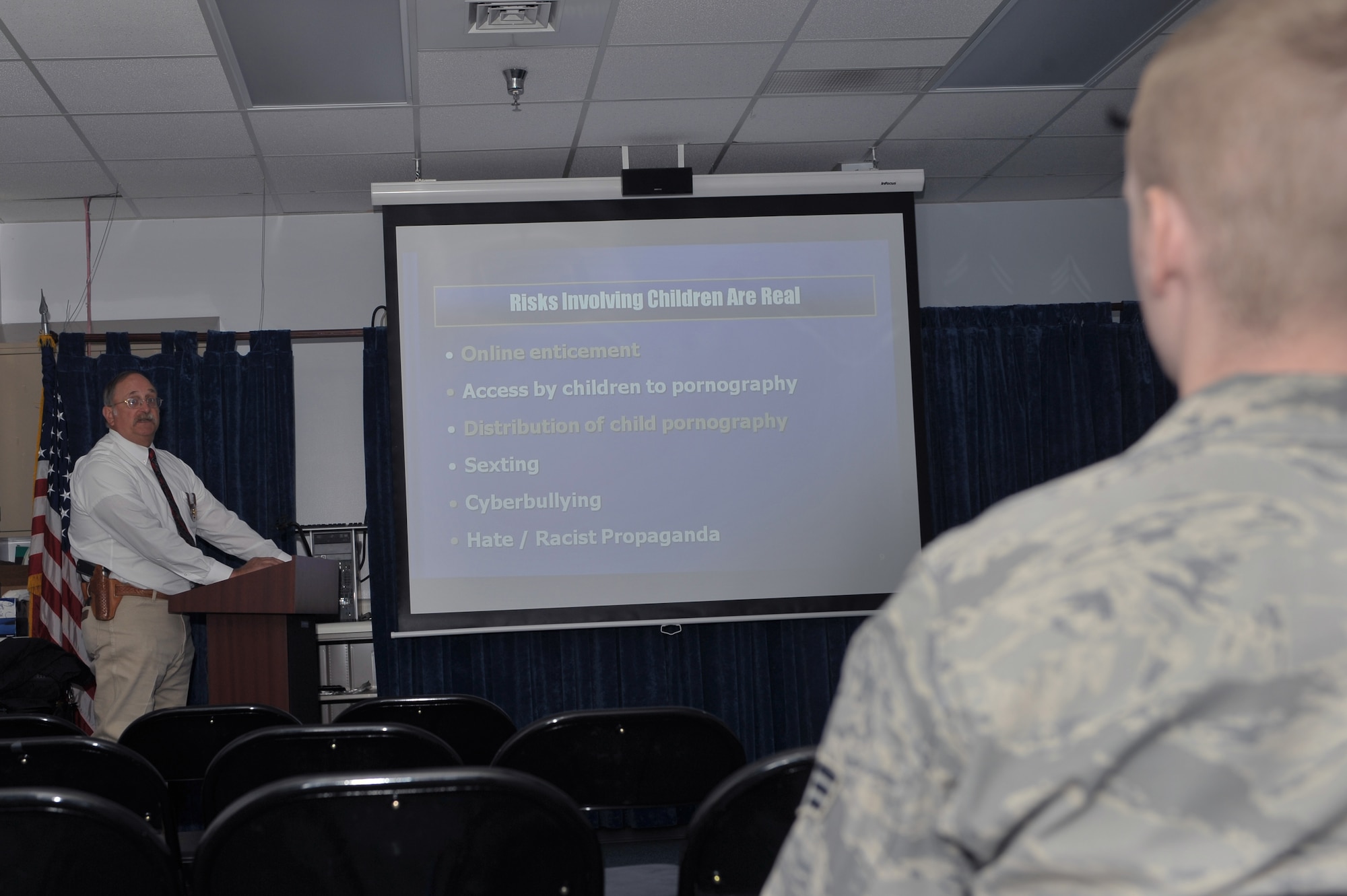 Mr. Sandy Loomis,Curry County Deputy Sherif, provides a lecture on cyber bullying at the Cannon Air Force Base clinic, Nov. 23.  Mr. Loomis went over various topics such as sexting, online solicitation and cyberbullying.  (U.S. Air Force photo by Senior Airman James Bell)