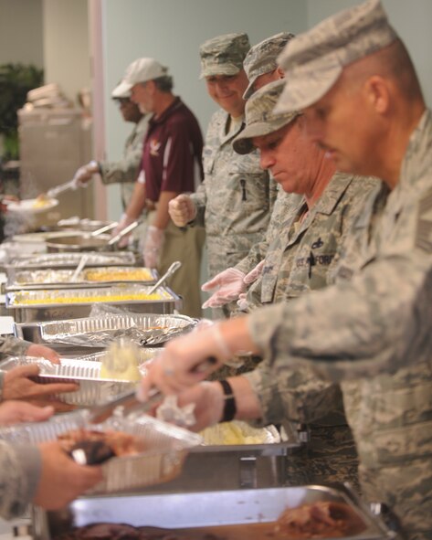 MOODY AIR FORCE BASE, Ga. -- Senior NCOs from various units on base serve food to Airmen during the Airman's Thanksgiving Luncheon at the base chapel Nov. 23. The lunch was only for Airmen because many of them weren't able to go home for the holidays. (U.S. Air Force photo/Airman 1st Class Douglas Ellis)(RELEASED)