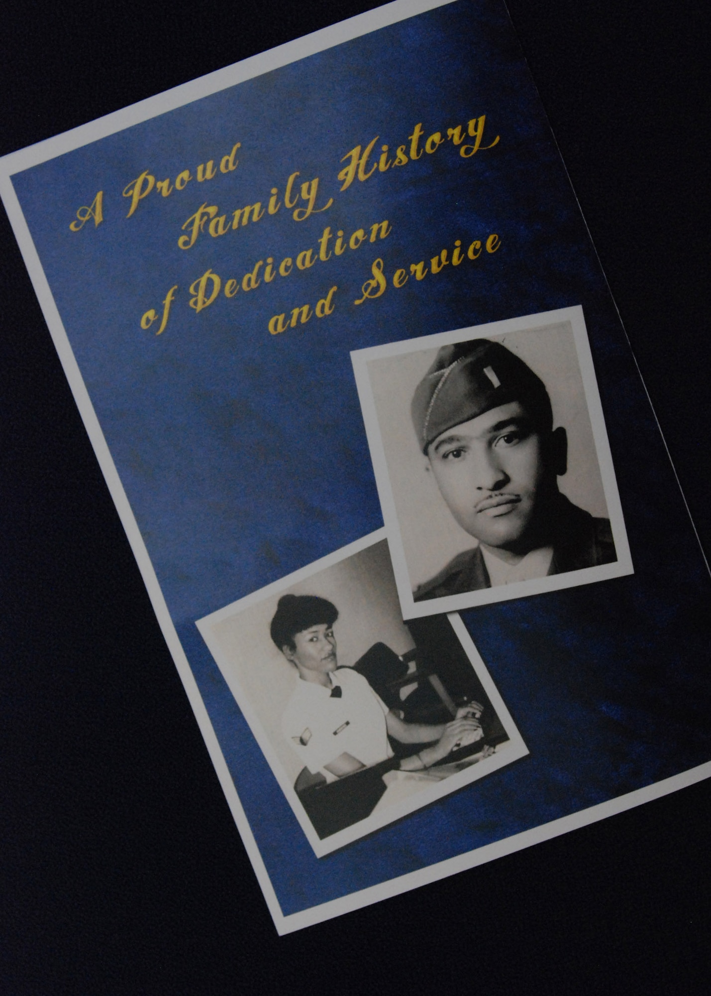 The retirement brochure of Senior Master Sgt. Sherry Taylor, 22nd Air Force Information Systems NCOIC, featured her father’s Army Air Corps photograph on the cover.  Sergeant Taylor’s father—Maj. Clyde Cullen Long, Jr.—was a Tuskegee Airman who was trained as a P-51 Mustang pilot during World War II.  He piloted the aircraft during the Korean War.  (U.S. Air Force photo/Master Sgt. Stan Coleman)  