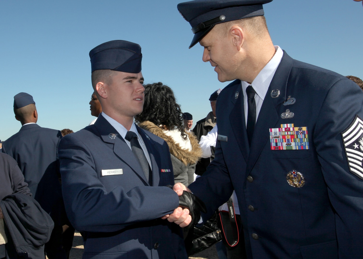 Chief Master Sgt. of the Air Force James A. Roy shakes hands with Airman Jonathon Kennedy after the Air Force Basic Military Training graduation Nov. 19. During his trip to Lackland, Chief Roy visited the 344th Training Squadron, had lunch with military training leaders and spoke to students at the Robert D. Gaylor NCO Academy. (U.S. Air Force photo/Robbin Cresswell)