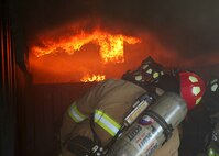 Fort Sam Houston firefighters train on handling flashovers at the Lackland flashover trainer Nov. 16. All Joint Base San Antonio flashover training is conducted at Lackland. (U.S. Air Force photo/Robbin Cresswell)