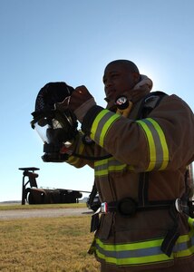 Jason Venzant, a firefighter at Fort Sam Houston, gets ready for flashover training at Lackland Nov. 16. (U.S. Air Force photo/Robbin Cresswell)