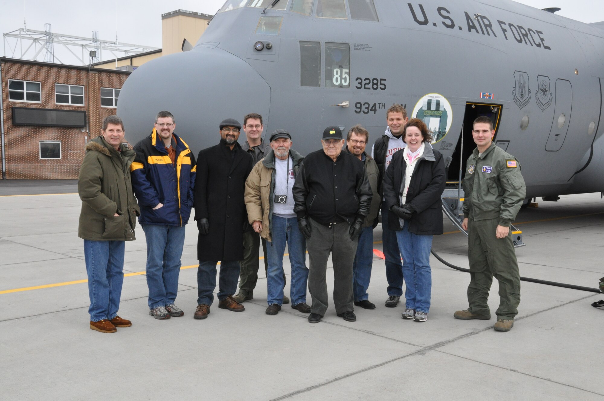Local Clergy members pose by a 934th Airlift Wing C-130 after their orientation flight Nov. 19. (Air Force Photo/Breeanna Martinez)