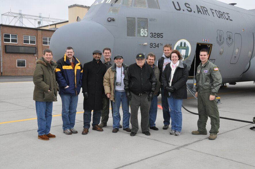 Local Clergy members pose by a 934th Airlift Wing C-130 after their orientation flight Nov. 19. (Air Force Photo/Breeanna Martinez)