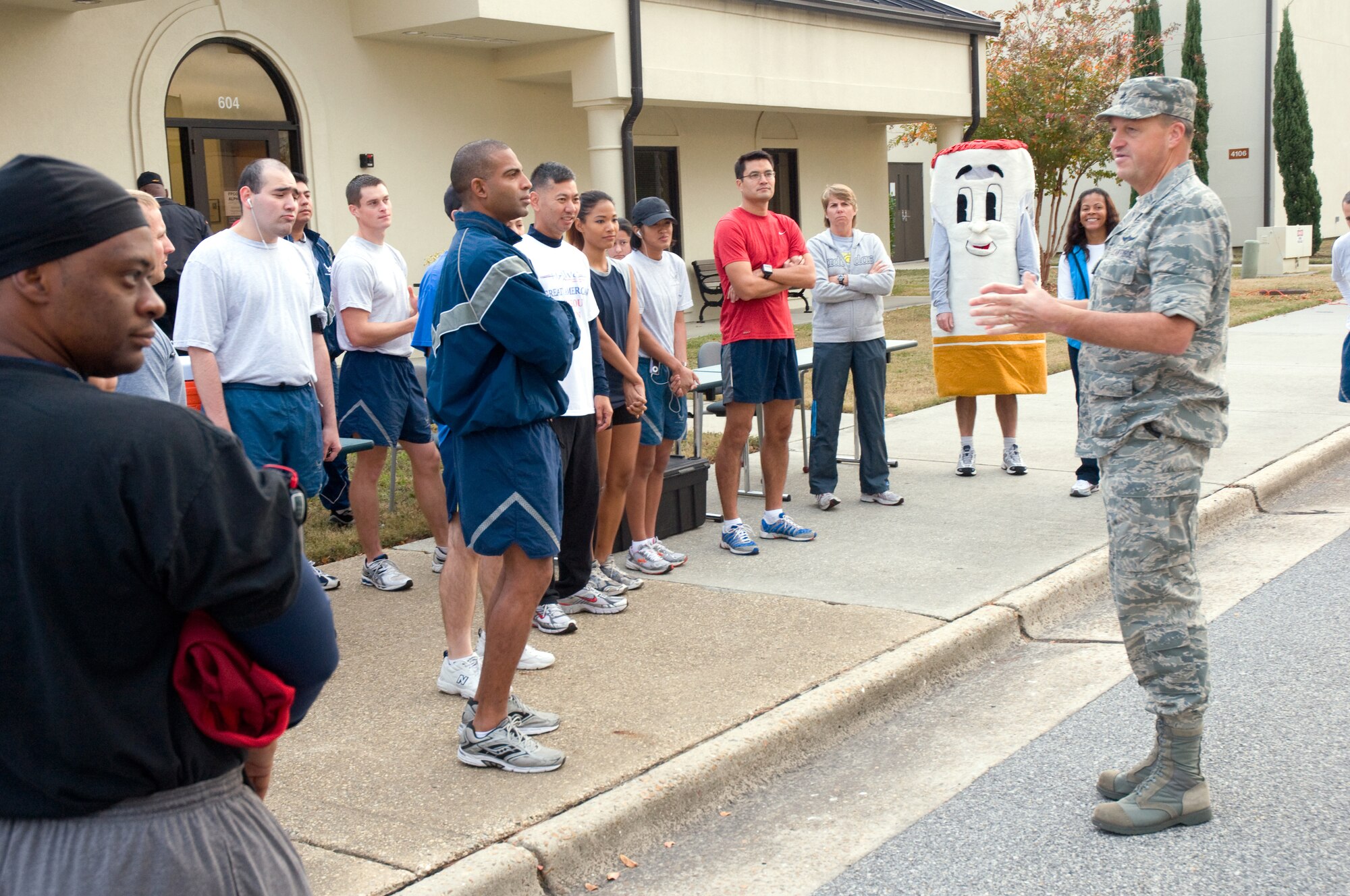 Brig. Gen. Kory Cornum, 81st Medical Group commander, gives a pep talk to runners before the run began at the health and wellness center. (U.S. Air Force photo by Adam Bond)