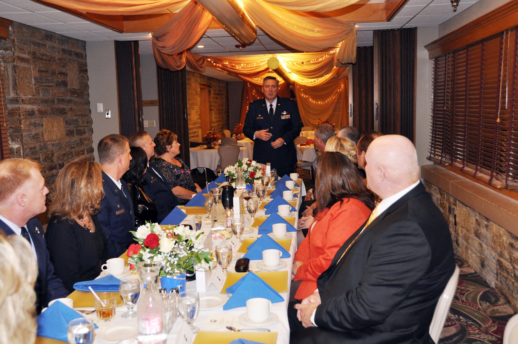 Col. Darrell G. Young, 934th Airlift Wing commander, welcomes honorary commanders, spouses and military host commanders to the first honorary commanders dinner Nov. 5 at the Officer's Club. (Air Force Photo/Paul Zadach)