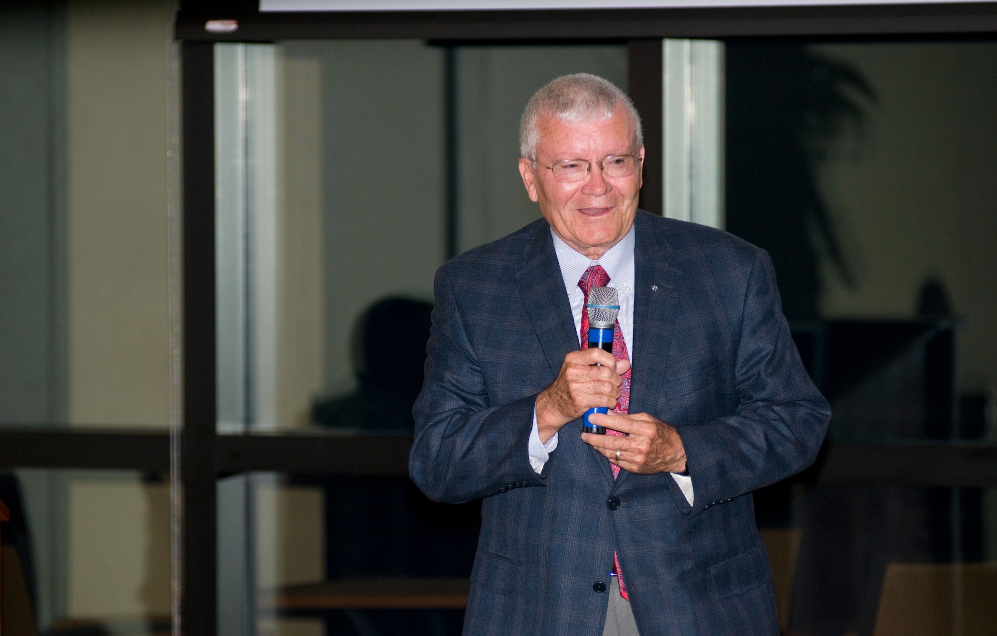Former Apollo 13 astronaut, Fred Haise, takes audience questions at the Bay Breeze Event Center Nov. 17. (U.S. Air Force photo by Adam Bond)