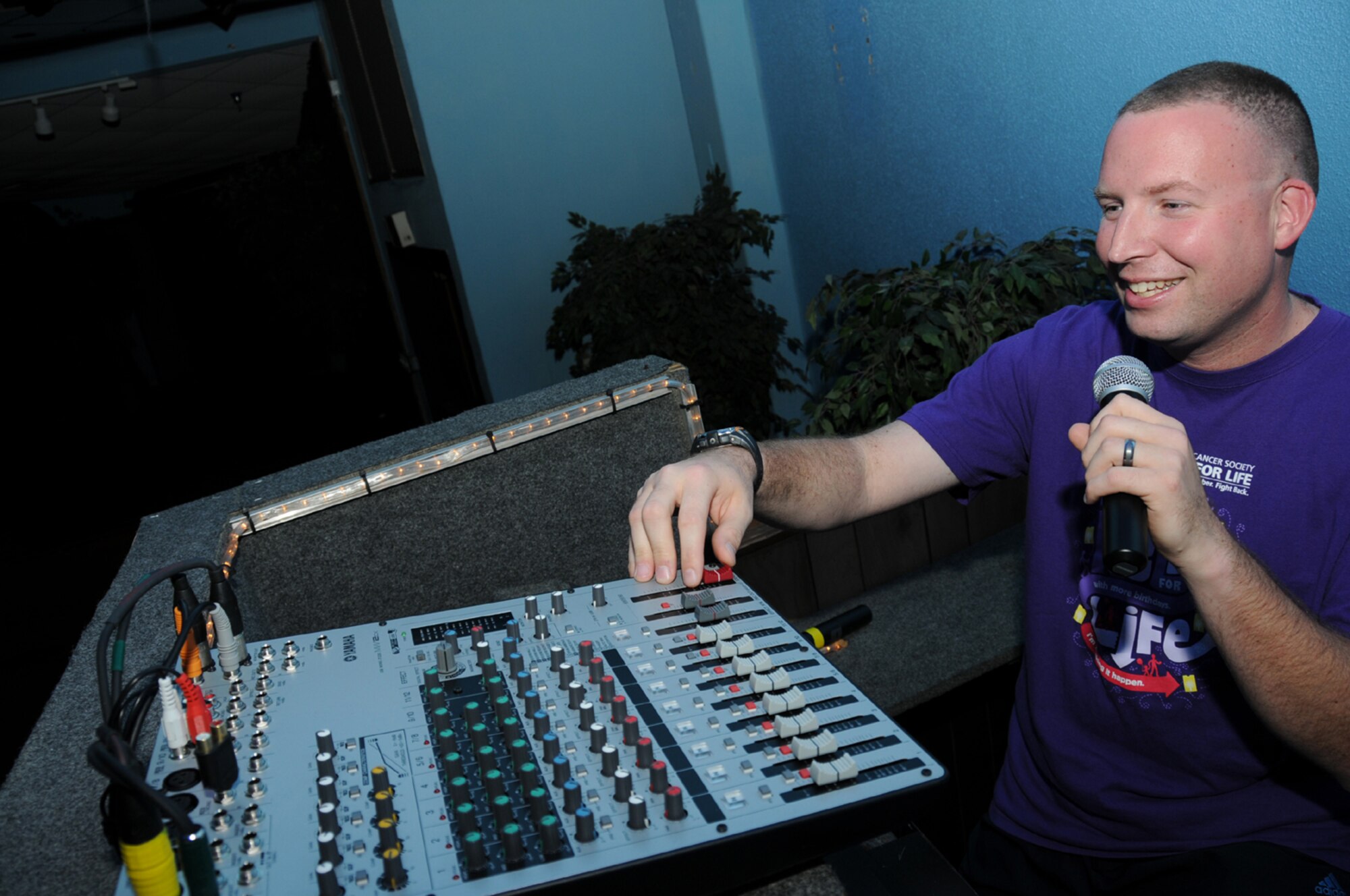 As a cancer survivor, Brian volunteers with the American Cancer Society, providing sound, lighting and DJ services for area Relay for Life events. He also provides these services without charge to some base and community organizations. (Photo By Kemberly Groue) 