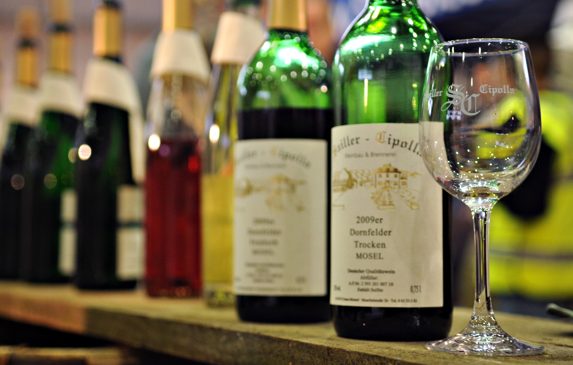 SPANGDAHLEM AIR BASE, Germany – An empty wine glass sits near sample bottles of wine from a local vineyard during the Eifel Holiday Bazaar Nov. 19. The bazaar was hosted by the Spangdahlem’s Officer’s and Civilian’s Spouses’ Club and included vendors from across Europe. (U.S. Air Force photo/Staff Sgt. Benjamin Wilson)