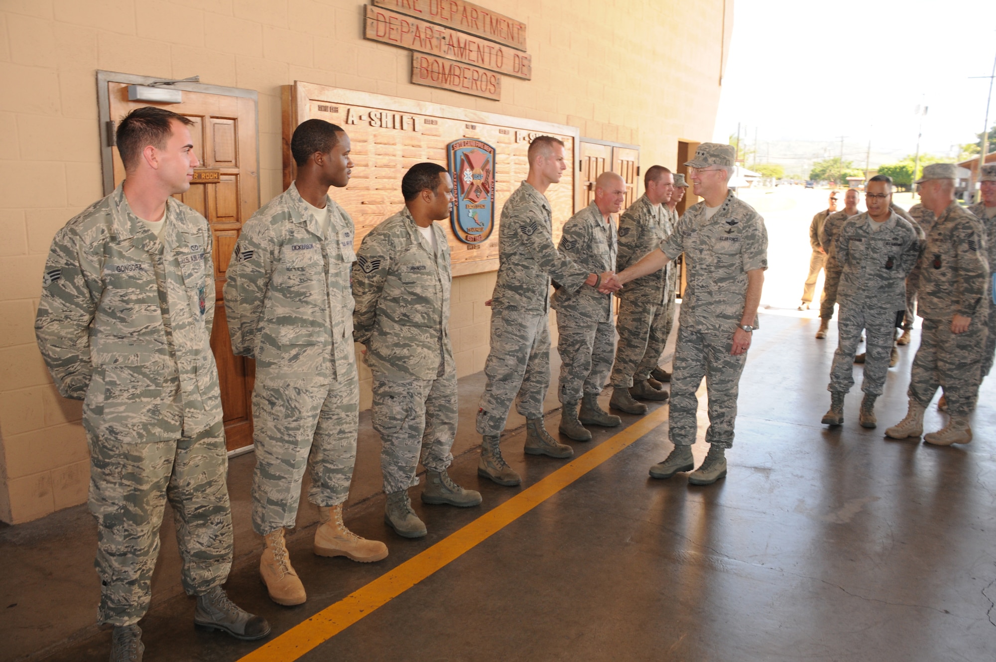 SOTO CANO AIR BASE, Honduras --  Gen. Douglas Fraser, center, the commander of the U.S. Southern Command, visits with 612th Air Base Squadron firefighters here Nov. 25. General Fraser gave coins to some outstanding performers and thanked the firefighters for their service. (U.S. Air Force photo/Tech. Sgt. Benjamin Rojek)
