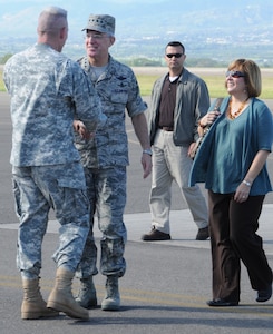 SOTO CANO AIR BASE, Honduras --  Col. Gregory Reilly, left, the Joint Task Force-Bravo commander, greets Gen. Douglas Fraser, the commander of the U.S. Southern Command, and his wife Rena on the flightline here Nov. 25. General Fraser visited Soto Cano to visit with and thank Team Bravo members for their service. (U.S. Air Force photo/Tech. Sgt. Benjamin Rojek)