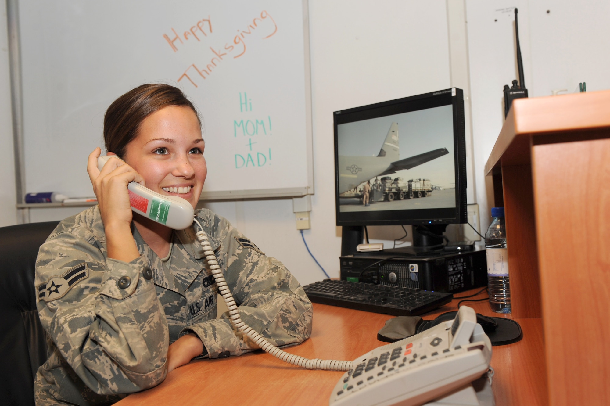 Airman 1st Class Erin Patton talks to President Barack Obama during a presidential phone call Nov. 25, 2010, at Kandahar Airfield, Afghanistan. Airman Patton, from St. Louis, is an HH-60G Pave Hawk crew chief assigned to the 451st Expeditionary Aircraft Maintenance Squadron, 55th Expeditionary Helicopter Maintenance Unit. The president traditionally calls several members of the military serving around the world during Thanksgiving. (U.S. Air Force photo by Tech. Sgt. Chad Chisholm/Released)