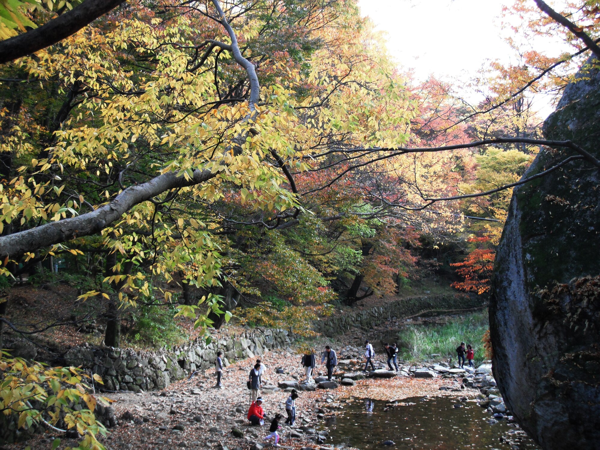 Visitors cross a small stream near Beopjusa temple in Songnisan National Park, Republic of Korea. (U.S. Air Force photo/Staff Sgt. Eric Burks)