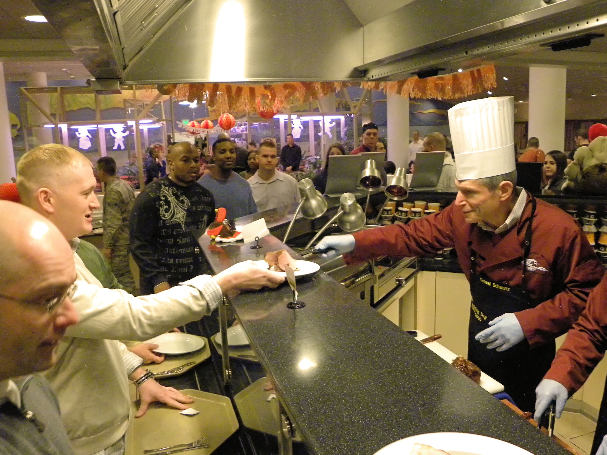 Air Force Chief of Staff Gen. Norton Schwartz serves the men and women of Thule Air Base, Greenland, their Thanksgiving meals on Nov. 25, 2010, at Dundas Restaurant. Dundas is the only dining facility at Thule AB. (U.S. Air Force photo/ Staff Sgt. Sarah Beasley)