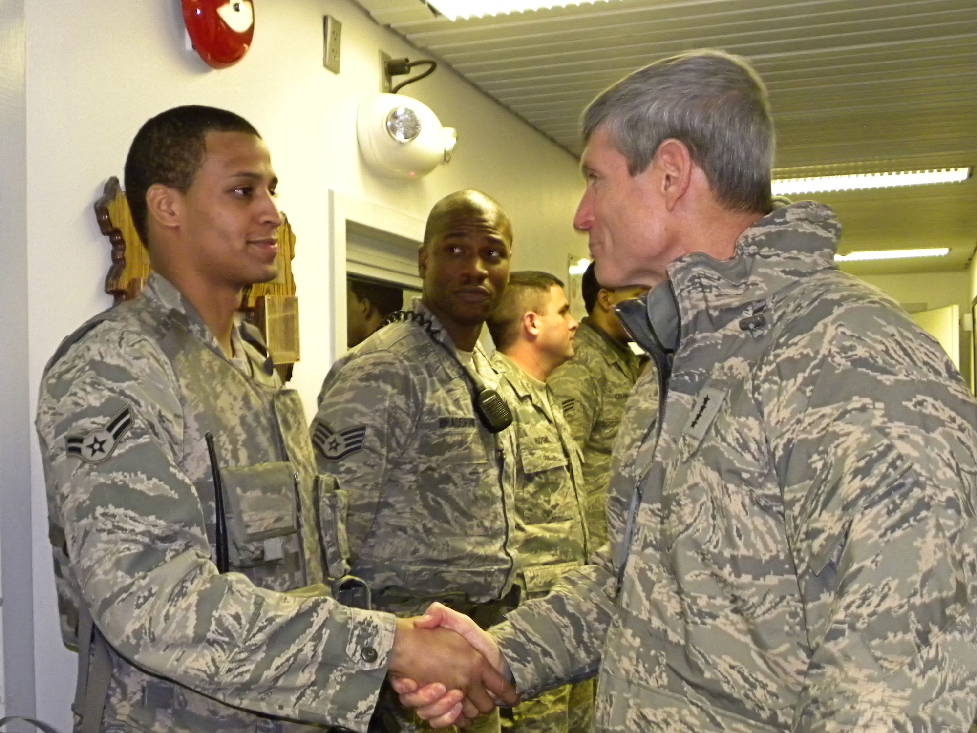 Air Force Chief of Staff Gen. Norton Schwartz shakes hands with Airman 1st Class Paul Milan of the 821st Security Forces Squadron at Thule Air Base, Greenland, on Nov. 25, 2010, during a Thanksgiving visit.  Thule AB is the Department of Defense's northernmost installation. (U.S. Air Force photo/ Staff Sgt. Sarah Beasley)