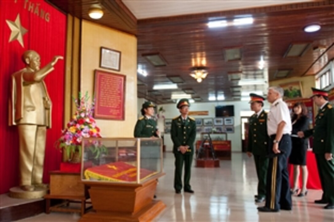 U.S. Army Chief of Staff Gen. George W. Casey Jr., third from right, looks at a statue of Ho Chi Minh during a visit to the Museum of the 308th Infantry Division near Hanoi, Vietnam, Nov. 22, 2010. This visit marked the 15th anniversary of the normalization of United States-Vietnam diplomatic relations. 