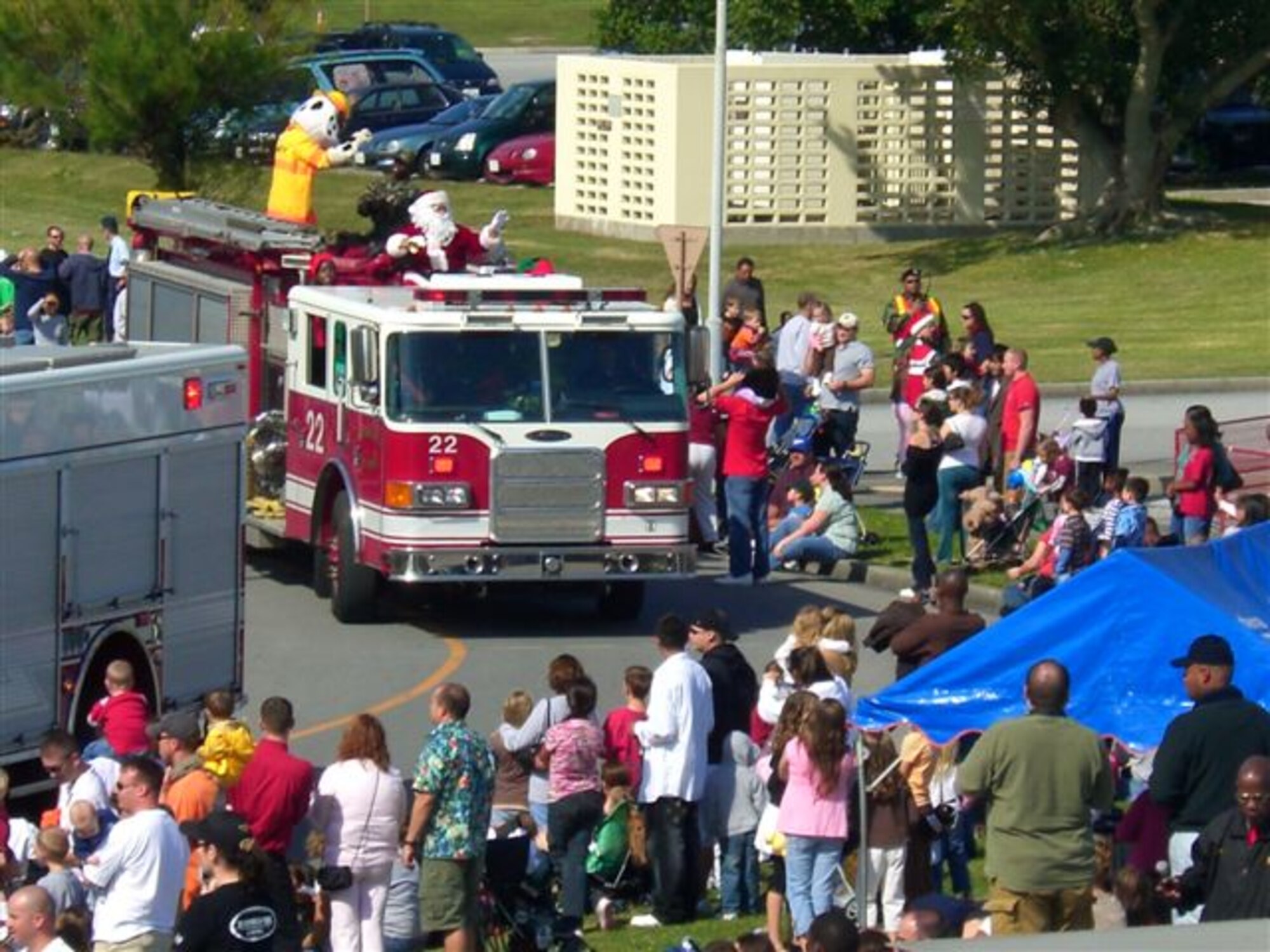 Families line the street near the Schilling Community Center as a parade rolls through Tinsel Town. With a parade, rides for children, contests and much more, this year’s Tinsel Town will kick off the holiday season, Dec. 4. (Courtesy photo by Amelia Lockamy-Keller)