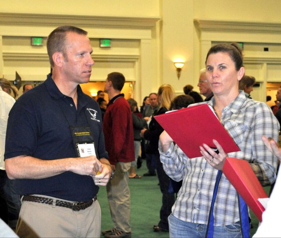 Chaplain Craig Benson answers questions during a briefing sign up opportunity. March Air Reserve Base held a Yellow Ribbon event November 12-14 in San Diego with Airmen attending from March, Beale, McChord and Travis Air Bases.  (U.S. Air Force photo by Valerie M Palacios)