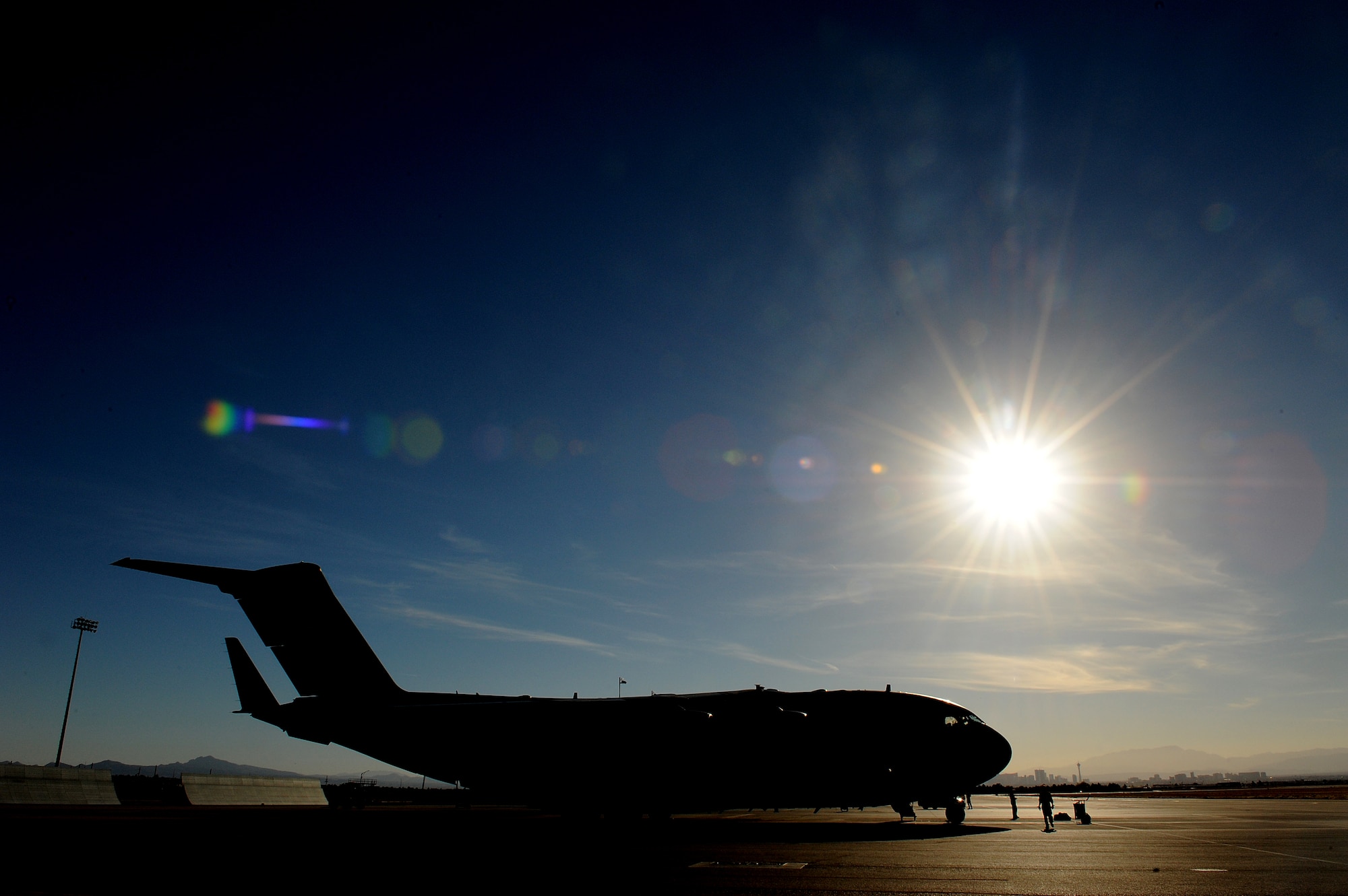 A 535th Airlift Squadron C-17 Globemaster III arrives at Nellis Air Force Base, Nev., at the conclusion of the Mobility Air Forces Exercise 10-B Nov. 18. Airrcrew trained in unrestricted descent assault landings, air drop, combat offloads, air refueling, night vision goggle training, combat offloads, low levels, mountainous terrain, assault landings, threat responses and multiple ship formation training during a five day training trip to Washington Nov 12-17 leading up to the MAFEX. (U.S. Air Force photo/Staff Sgt. Mike Meares)