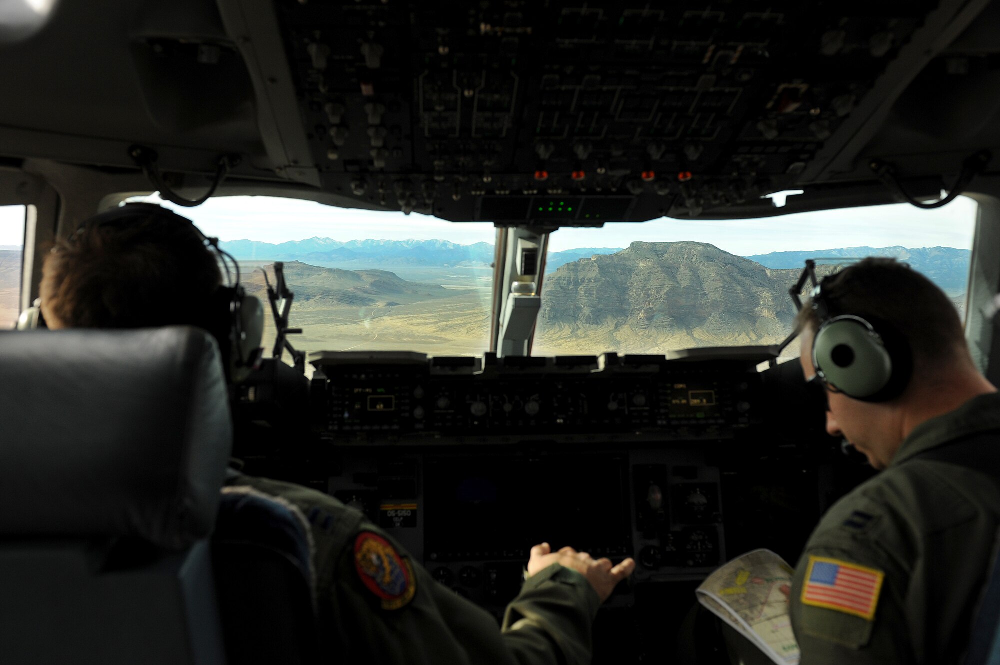 Capts. Rob Greeson and Nate Padgett, 535th Airlift Squadron pilots, fly a C-17 toward a drop zone during the Mobility Air Forces Exercise Nov. 17. The 535th AS aircrew trained in unrestricted descent assault landings, air drop, combat offloads, air refueling, night vision goggle training, combat offloads, low levels, mountainous terrain, assault landings, threat responses and multiple ship formation training during a five day training trip to Washington Nov 12-17 in preperation for the Mobility Air Forces Exercise at Nellis Air Force Base, Nev. (U.S. Air Force photo/Staff Sgt. Mike Meares)