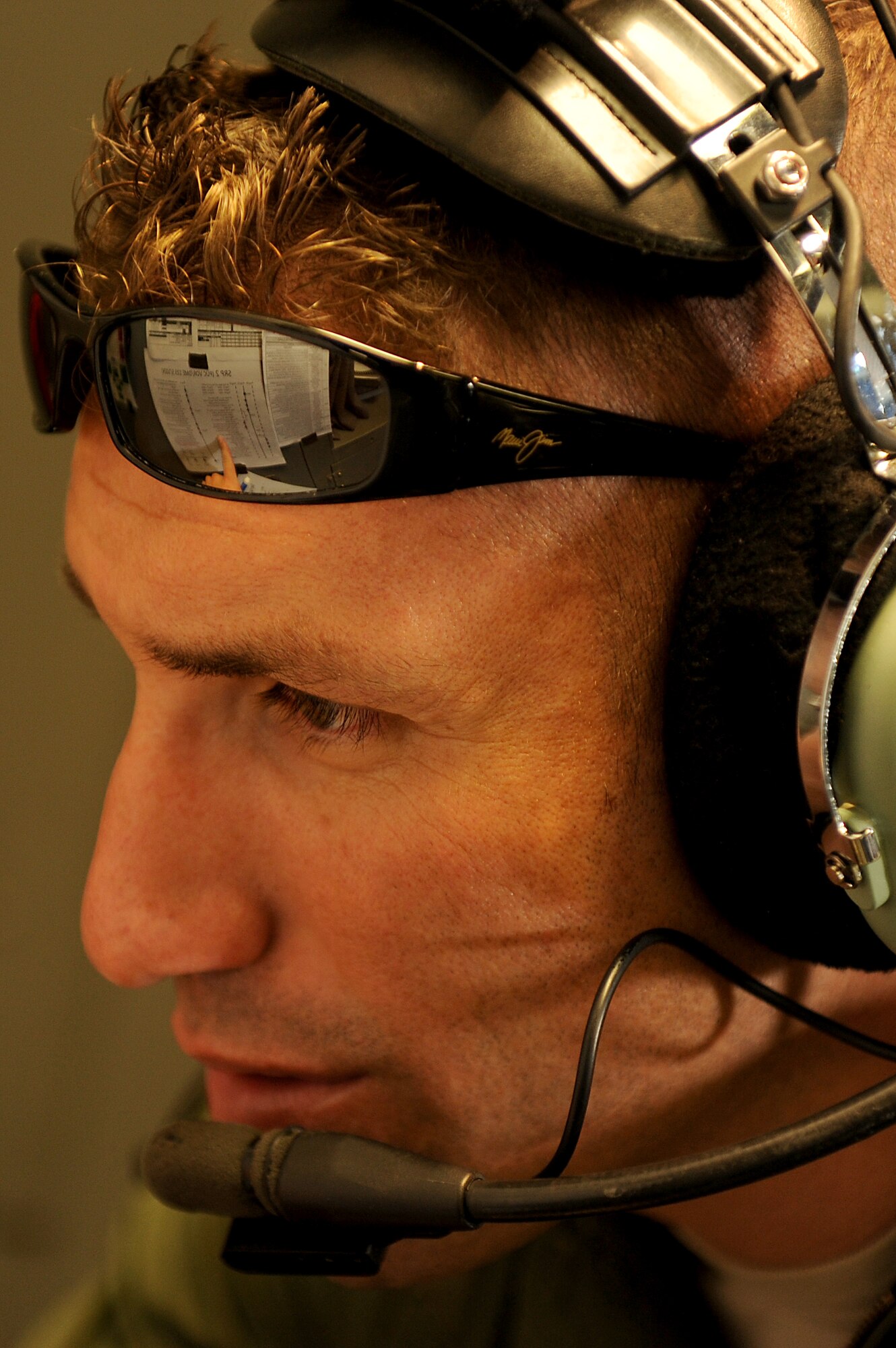 Capt. Dave Morales, 535th Airlift Squadron C-17 Globemaster III pilot, goes over the numbers during an airdrop training mission Nov. 18. The 535th AS airrcrew trained in unrestricted descent assault landings, air drop, combat offloads, air refueling, night vision goggle training, combat offloads, low levels, mountainous terrain, assault landings, threat responses and multiple ship formation training during a five day training trip to Washington Nov 12-17 leading up to the MAFEX. (U.S. Air Force photo/Staff Sgt. Mike Meares)