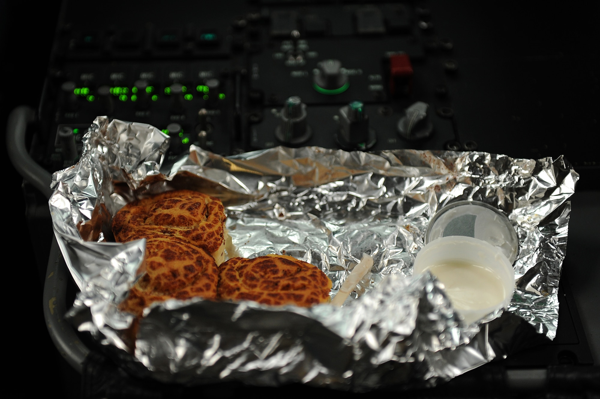 A 535th Airlift Squadron C-17 Globemaster III aircrew enjoys a little breakfast prepared in the oven onboard during an airdrop training mission Nov. 18. The 535th AS aircrew trained in unrestricted descent assault landings, air drop, combat offloads, air refueling, night vision goggle training, combat offloads, low levels, mountainous terrain, assault landings, threat responses and multiple ship formation training during a five day training trip to Washington Nov 12-17 and participated in the Mobility Air Forces Exercise at Nellis Air Force Base, Nev., Nov. 18. (U.S. Air Force photo/Staff Sgt. Mike Meares)