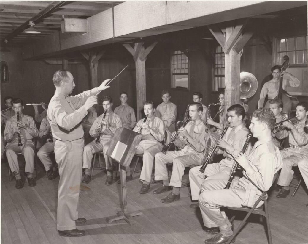 Chief Warrant Officer Samuel Kurtz rehearses students during one of their required classes. Any additional information about this photograph can be sent to our Band Historian <a href="mailto:usafbandhistorian@afncr.af.mil">Tech. Sgt. Tracey MacDonald</a>. Thank you and we look forward to hearing from you!  This is Photo 39. (Unknown Photographer)